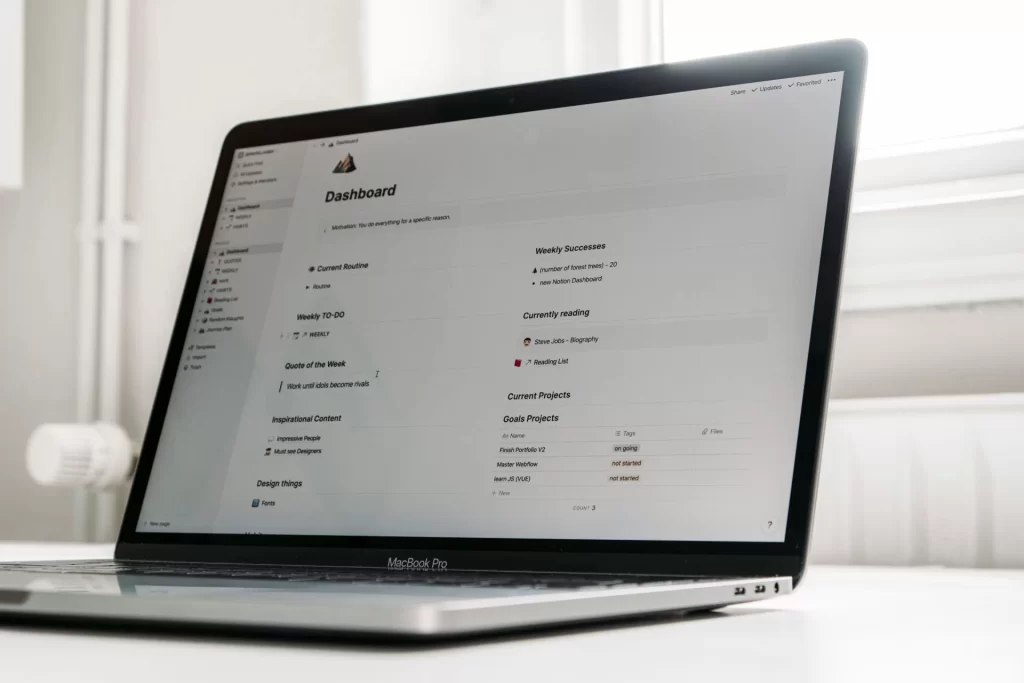 Open laptop on a tidy desk displaying an information dashboard